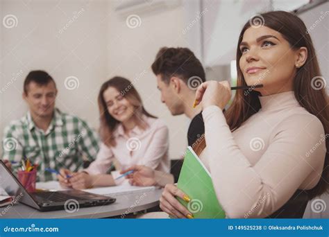 Group Of Young People Studying Together At College Classroom Stock