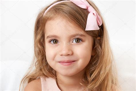 Adorable little child girl face closeup portrait Stock Photo by ©soleg 128379356