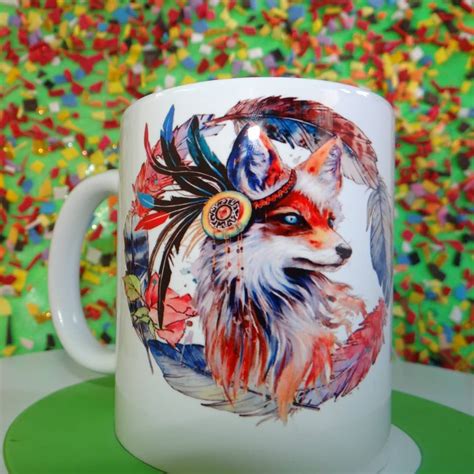 A White Coffee Mug With An Image Of A Fox On It