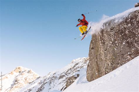 Extreme Skier Jumping From A High Cliff Del Colaborador De Stocksy