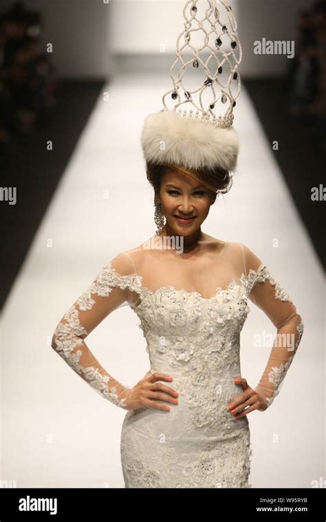 Chinese American Singer Coco Lee Poses During The Dorian Ho Fashion