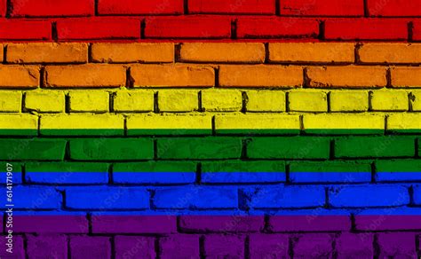 Flag Of The LGBT Community On The Background Of A Stone Wall Rainbow Symbol Of Gay Culture