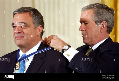 U.S. President George W. Bush awards the Presidential Medal of Freedom to former CIA Director ...