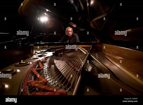 Portrait of Rick Wakeman seated at grand piano, Marlowe Theatre, Canterbury, Kent Stock Photo ...