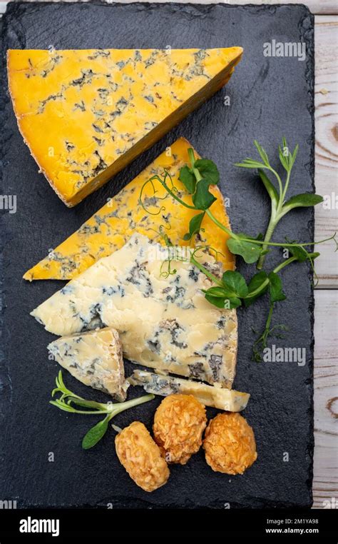 Tasting Of English Cheeses Blue Stilton And Blue Shropshire Close Up