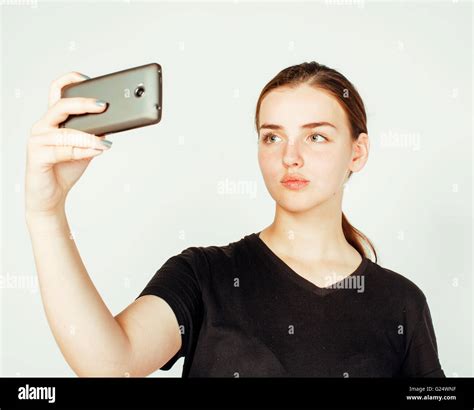 Young Pretty Teenage Girl Making Selfie Isolated On White Background