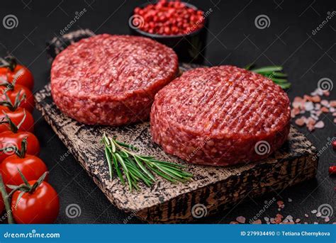 Fresh Raw Ground Beef Burger Patty With Salt And Spices Stock Photo