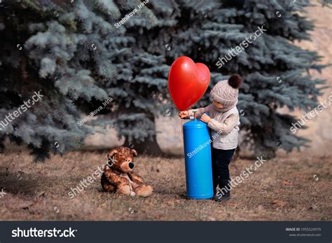 Little Boy Inflates Balloon Helium Baby Stock Photo Edit Now 1955520979