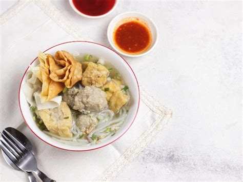 Premium Photo | Bakso or meatball soup indonesian meatball served with ...