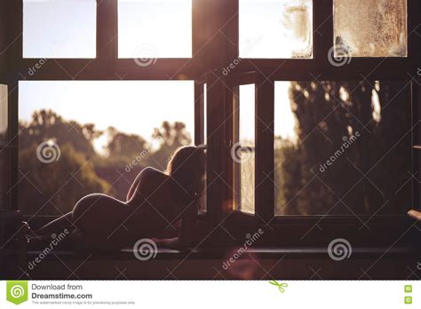 Beautiful Naked Female Sitting On A Window At Sunset Stock Photo Image Of Summer Pitch
