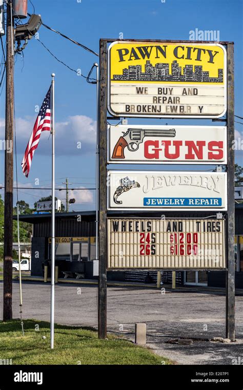 Advertising signs, gun shop and pawn shop with American flag, Georgia ...