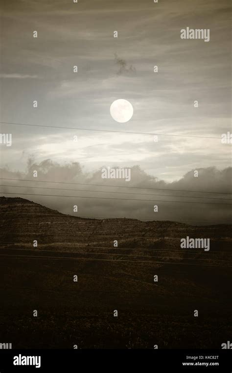 Full Moon Over The Mountains Stock Photo - Alamy