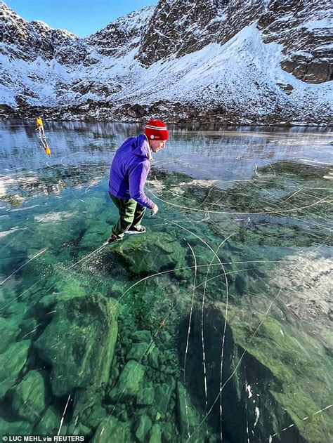 Incredible moment outdoor instructor and his wife skate across frozen ...