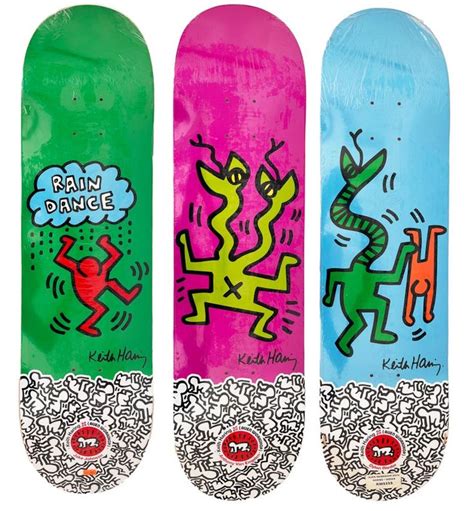 Three Skateboards With Different Designs On Them