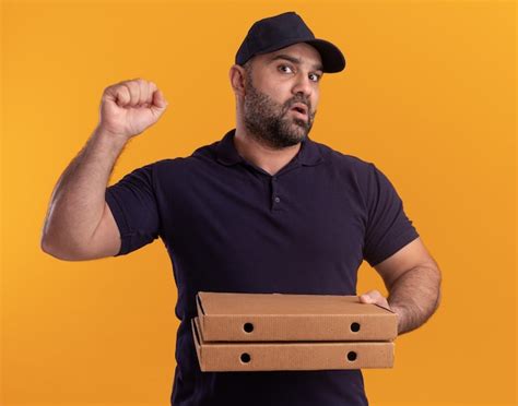 Free Photo Confused Middle Aged Delivery Man In Uniform And Cap