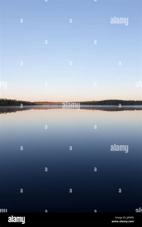 Still Lake Perfect Reflection Of Sky Stock Photo Alamy