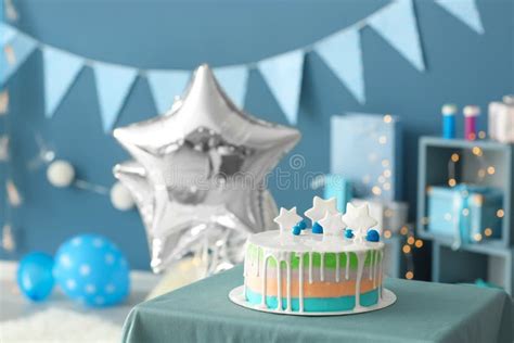 Birthday Cake on Table in Room Decorated for Party Stock Image - Image ...