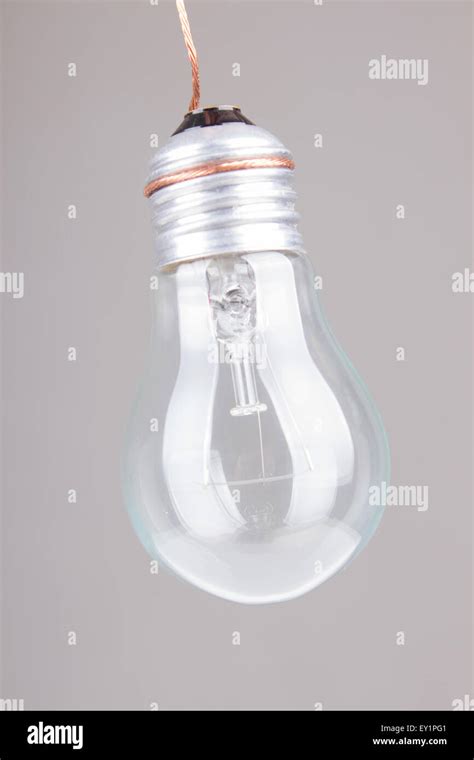 Clear light bulb with filament showing Stock Photo - Alamy