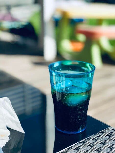 Premium Photo Close Up Of Coca Cola On Table