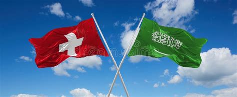 Two Crossed Flags Saudi Arabia And Switzerland Waving In Wind At Cloudy