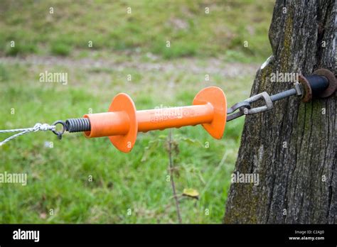 Electric fence gate handle Stock Photo - Alamy