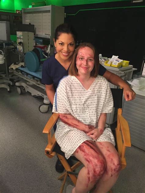 Two Women Sitting In Chairs With Blood All Over Their Body And Legs