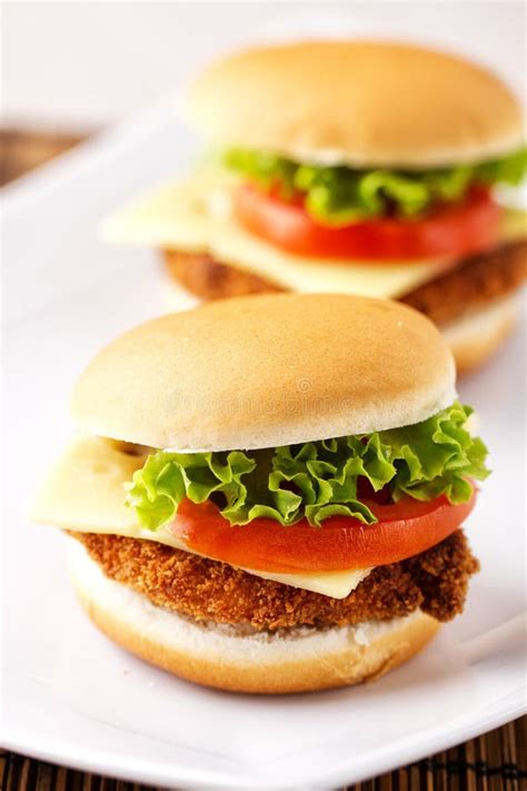 Mini Crispy Chicken Burger With Lettuce Tomato And Cheese Stock Photo