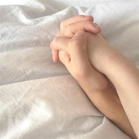 Premium Photo Cropped Image Of People Holding Hands On Bed At Home