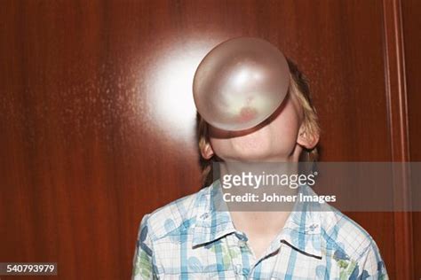 Boy Blowing Chewing Gum Bubble High-Res Stock Photo - Getty Images