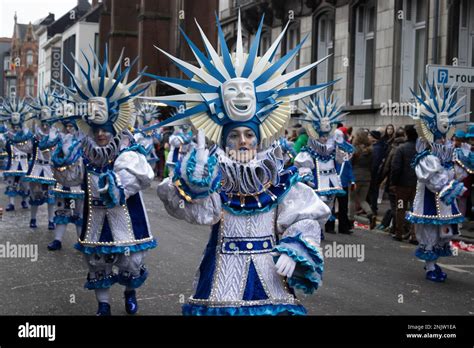 AALST, BELGIUM, 19 FEBRUARY 2023: Group of identically costumed dancers in Aalst carnival street ...