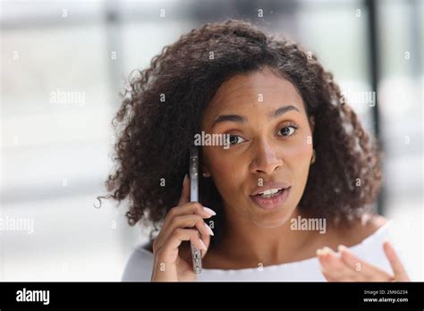 Portrait Of A Young Attractive African American Woman Talking On The