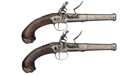 Pair Of English Silver Mounted Queen Anne Flintlock Pistols Rock