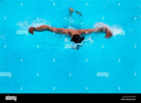 Man swimming butterfly stroke Stock Photo - Alamy