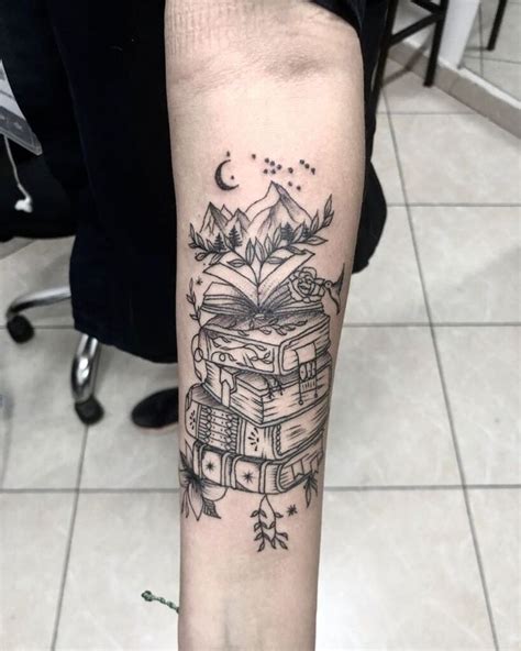 A Black And White Tattoo On The Arm Of A Person With A Stack Of Books