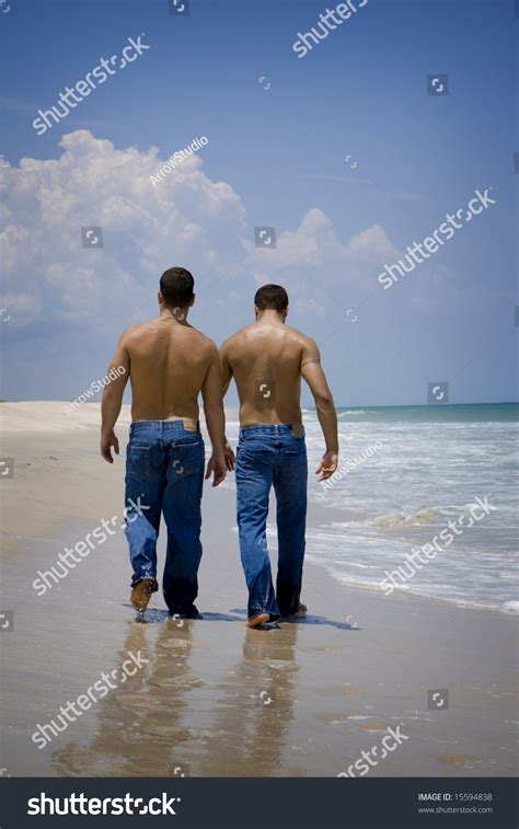 Two Gay Man In Jeans Walking On A Beach Stock Photo 15594838 Shutterstock