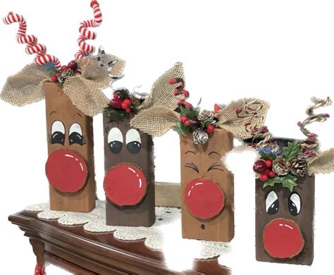 Three Brown Bags With Reindeer Noses And Nose Decorations