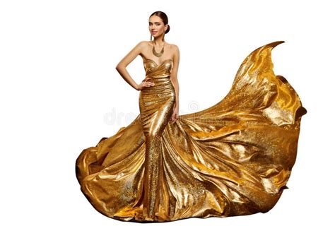 Gold Woman Flying Dress Fashion Model In Waving Art Golden Gown Stock