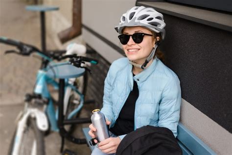 Premium Photo | Woman cyclist in a helmet and sunglasses