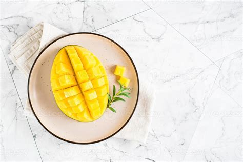 Ripe Mango Cubes On Plates On The Table Tropical Fruit Top View