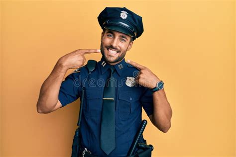 Handsome Hispanic Man Wearing Police Uniform Smiling Cheerful Showing