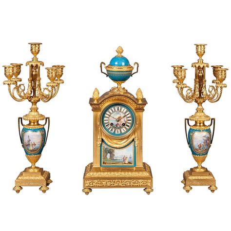 French Mantel Clock and Candelabra of Gilt Bronze and Blue Sèvres