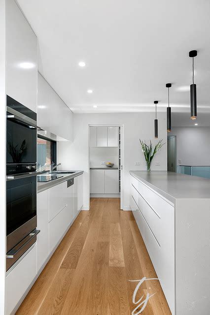 Modern White Kitchen With Window Splashback Contemporary Kitchen