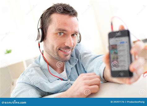 Young Relaxed Man Listening Music In A Sofa Stock Photo Image Of