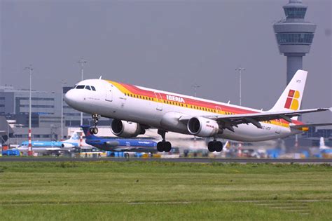 Download Iberia Airlines Airplane Takeoff On Busy Airport Wallpaper | Wallpapers.com