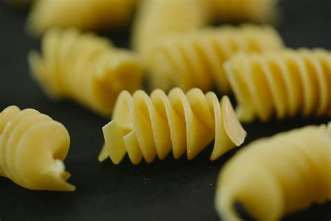 Twirl Italian pasta on table · Free Stock Photo