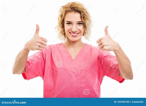 Portrait Of Young Nurse Wearing Pink Scrub Showing Double Like Gesture