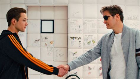 The Adidas Jacket With Orange Strips Of Gary Unwin Eggsy Taron Egerton In Kingsman The