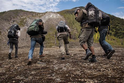 Five Men Running Near Mountain · Free Stock Photo