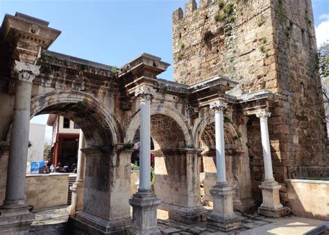 The Ruined Stone Entrance Gate Of The Ancient City With Arches And Tall
