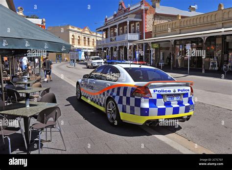 A Holden Police car, in Western Australian Police livery, in an urban ...